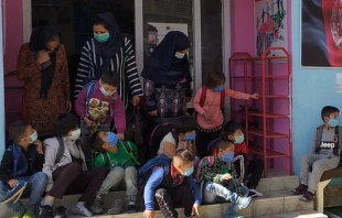 Children and teachers outside the free day center run by Catholic sisters of the association For the Children of Kabul in Kabul, Afghanistan. Courtesy of For the Children of Kabul